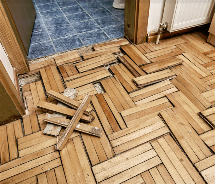 broken floor boards after severe storm damage