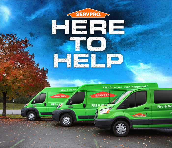 Here to help with 3 SERVPRO trucks