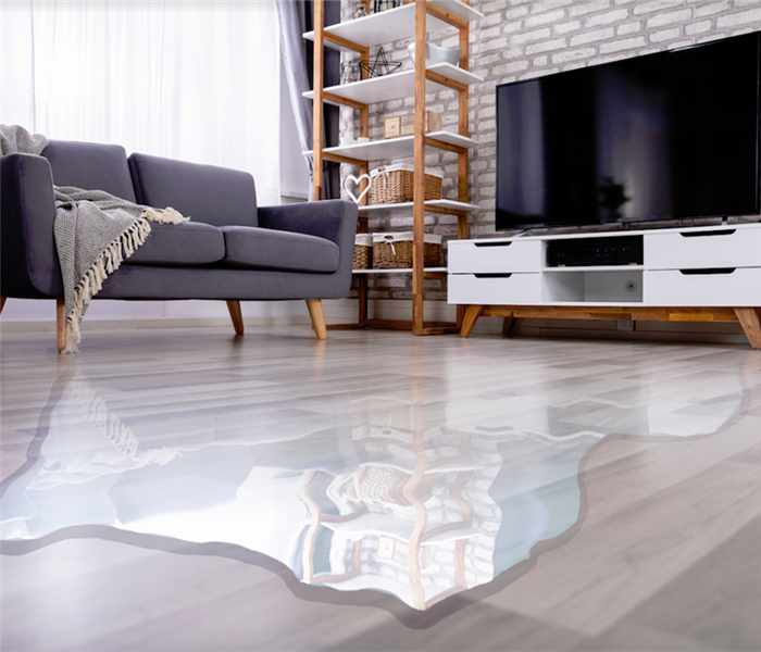a flooded living room with water covering the floor