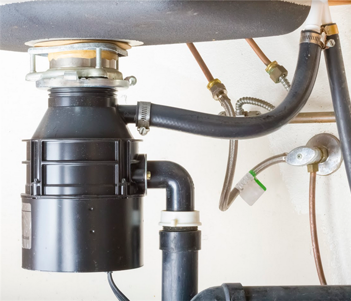 a garbage disposal under a sink