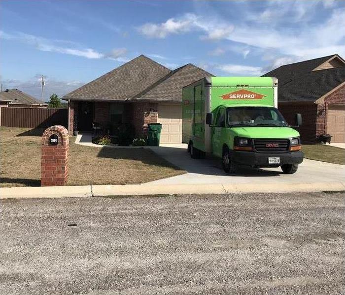 SERVPRO truck backed into driveway of home