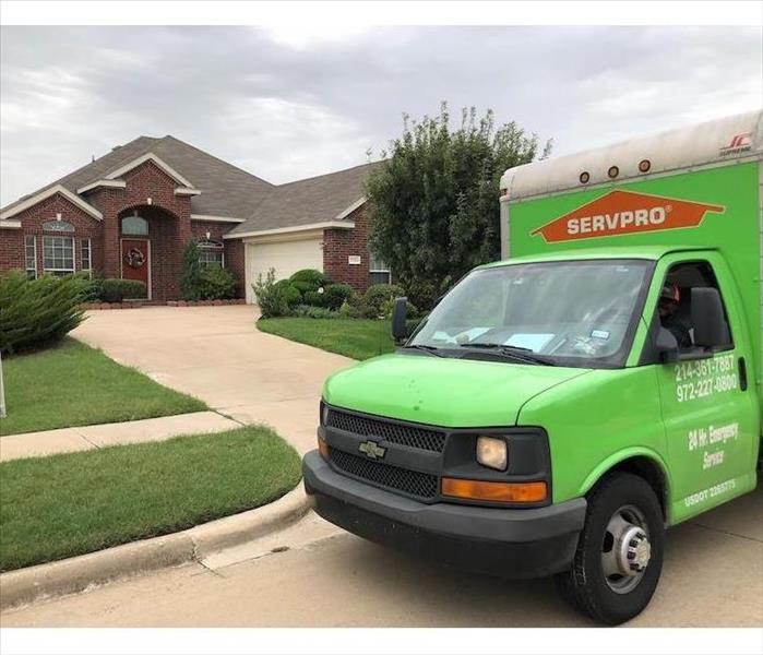 SERVPRO vehicle parked in front of home